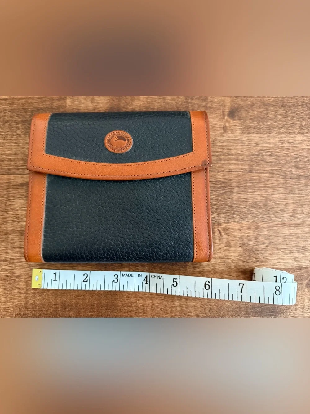 Dooney & Bourke Vintage Black and Tan Leather Bi-Fold Wallet